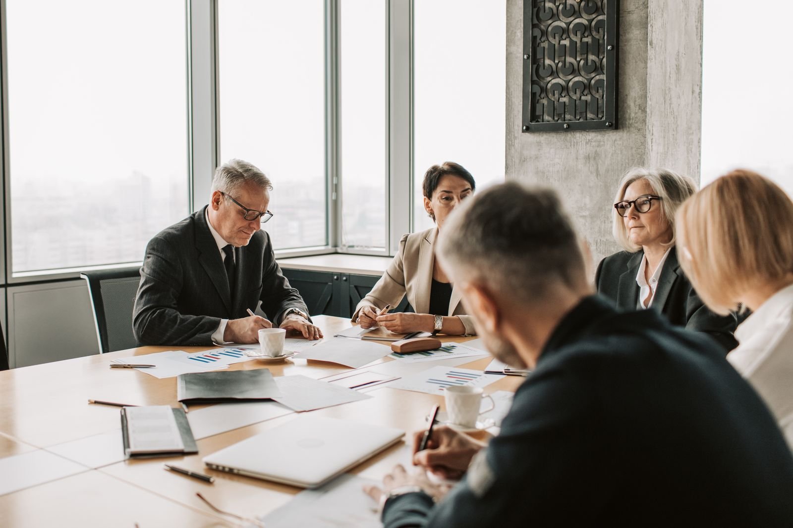 Business team in a boardroom meeting representing B2B versus B2C marketing differences