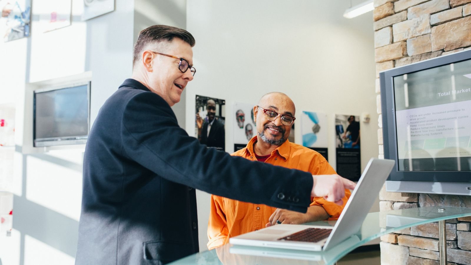Sales rep making a phone call at a desk, representing B2B cold calling